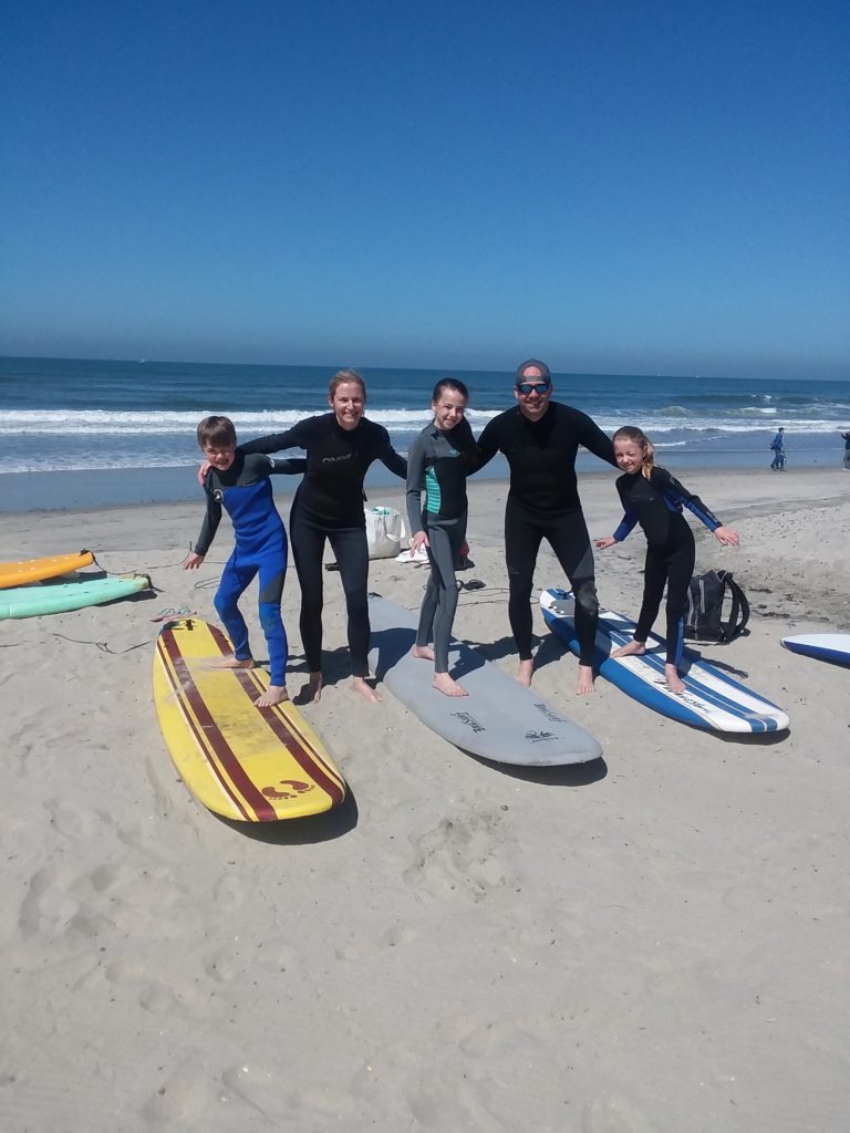 families learn surfing